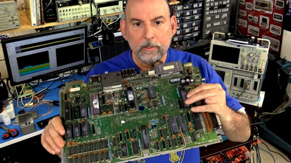 MCG engineer at the test bench with a circuit board and oscilloscopes